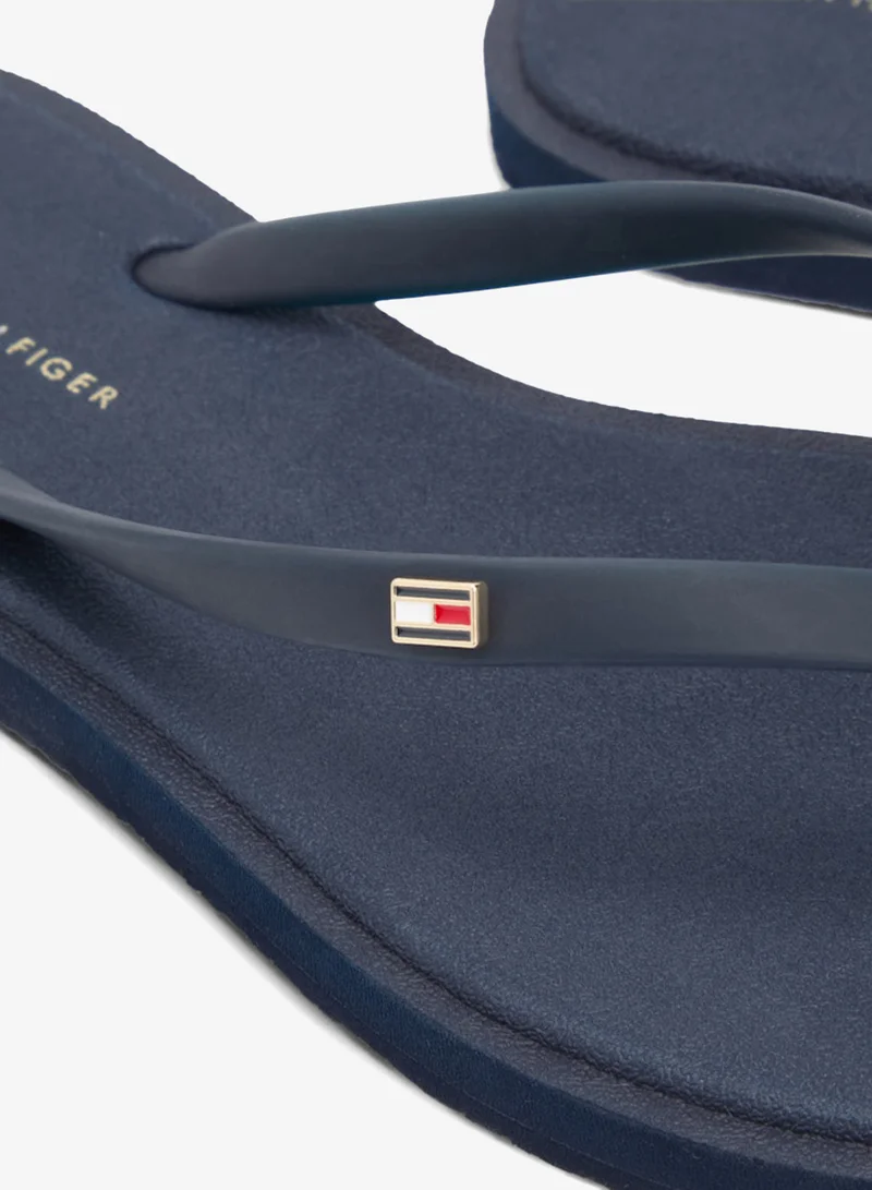 TOMMY HILFIGER  Chic Enamel Flag Flip-Flops for Women | Best Price UAE